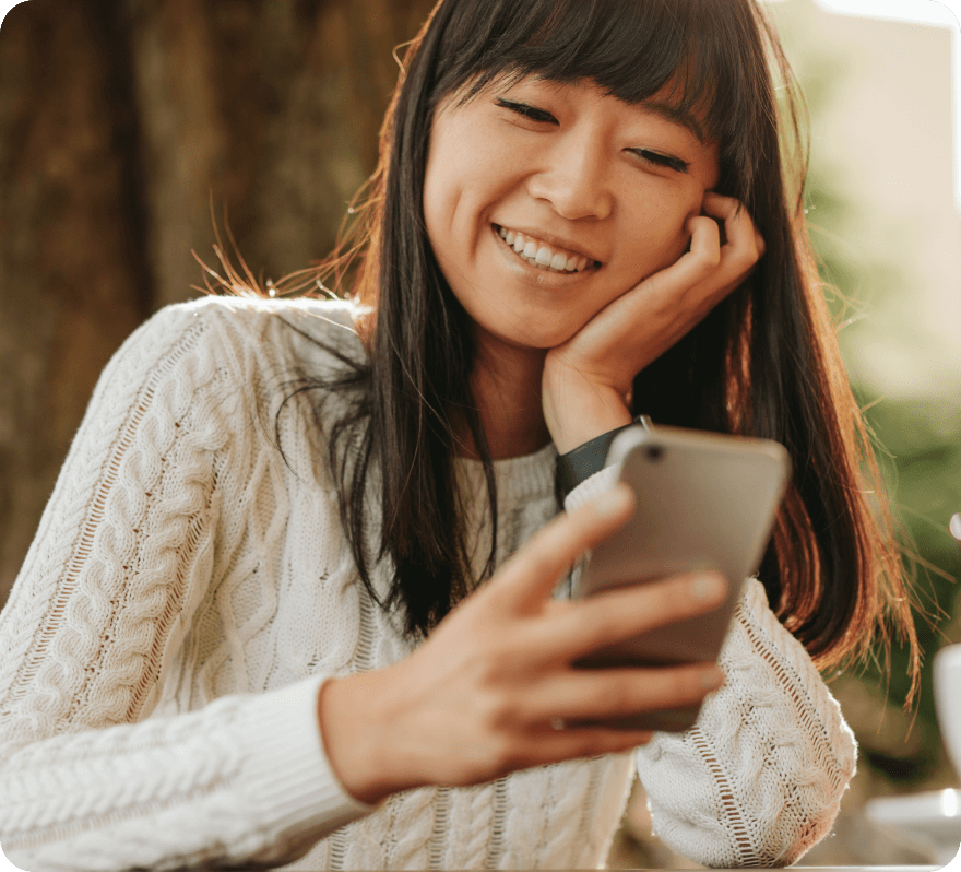 Person using smartphone outdoors